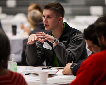 Seminarian Bryce Baumann participates in a discussion on on “Resource Management, Project Planning, and Growing the Church" during an Oct. 21 Diocese of Dallas synodal listening session at Cristo Rey Dallas College Preparatory School. The event marked the final of 30 synodal listening sessions since 2021. (Michael Gresham/The Texas Catholic)