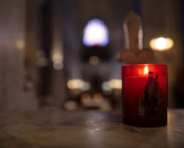 A file photo shows a candle inside the sanctuary of the Shrine of Our Lady of Montligeon in France. Dubbed "the shrine that does good to souls," Montligeon is located about 93 miles west of Paris and is famous for praying for the deceased and supporting their families. (OSV News photo/courtesy Montligeon Sanctuary)