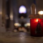 A file photo shows a candle inside the sanctuary of the Shrine of Our Lady of Montligeon in France. Dubbed "the shrine that does good to souls," Montligeon is located about 93 miles west of Paris and is famous for praying for the deceased and supporting their families. (OSV News photo/courtesy Montligeon Sanctuary)