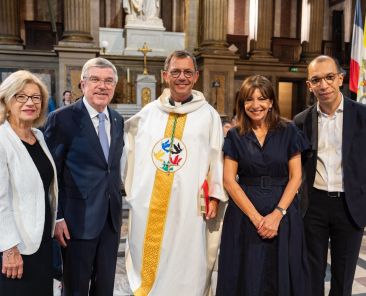 Bishop Emmanuel Gobilliard of Digne, France, center, who is a special representative of the Holy See for the 2024 Paris Olympics, celebrated Mass with Archbishop Laurent Ulrich of Paris July 19, 2024, to launch the Olympic truce in the presence of over a hundred diplomatic delegations, including one from the International Olympic Committee, led by IOC President Thomas Bach, seen at left next to Bishop Gobillard, and Paris Mayor Anne Hidalgo, seen at right next to the bishop. The feast of St. Mary Magdalene is July 22. (OSV News photo/courtesy IOC)