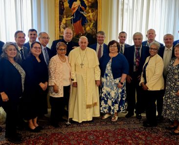 Pope Francis poses for a photo with community organizers from the West/Southwest Industrial Areas Foundation after a private meeting in the Domus Sanctae Marthae at the Vatican Aug. 28, 2024. (CNS photo/courtesy of IAF)