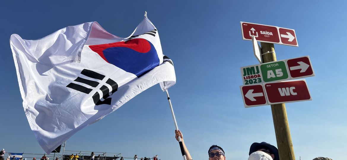 A man from South Korea waves his country's flag.