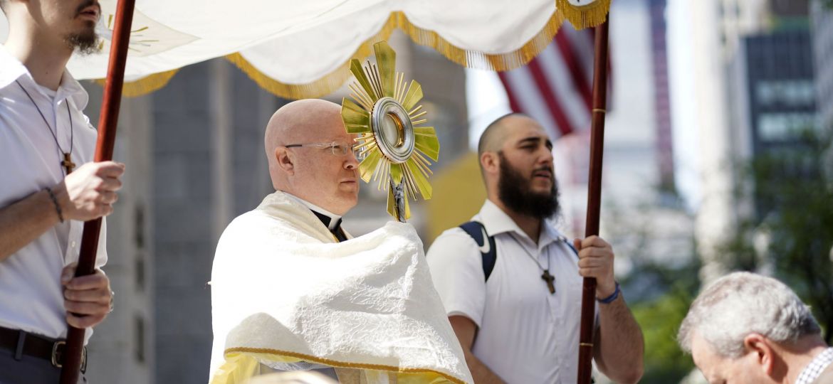 Father Roger Landry, National Eucharistic Pilgrimage chaplain, pauses to offer a blessing with the monstrance as pilgrims on the National Eucharistic Pilgrimage's Seton Route arrive for Mass at St. Patrick's Cathedral in New York City.