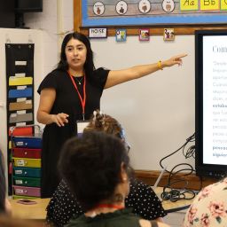 Jessica Martinez points to a presentation while presenting to participants in the Parish Ministry Conference South event at St. Cecilia Catholic Parish.