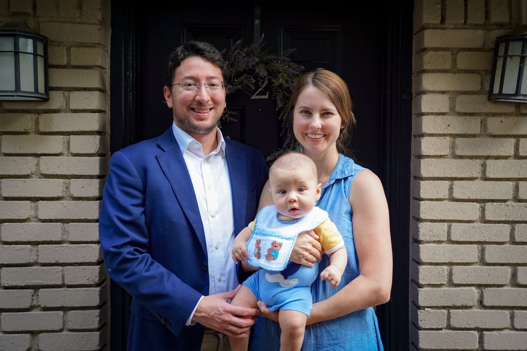 Christian and Julia Monsalve smile as they hold their son Joseph.