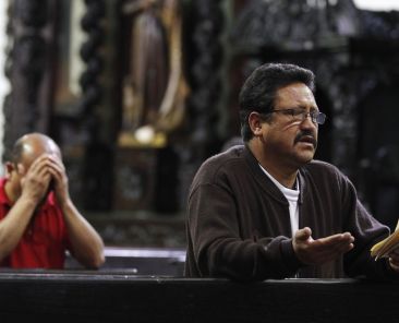 Men are pictured in a file photo praying at San Francisco Church in Bogota, Colombia. (OSV News photo/John Vizcaino, Reuters)