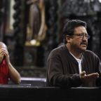 Men are pictured in a file photo praying at San Francisco Church in Bogota, Colombia. (OSV News photo/John Vizcaino, Reuters)