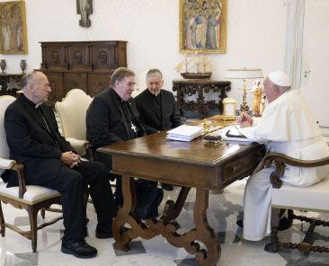 Pope Francis speaks with three U.S. cardinals -- Cardinals Robert W. McElroy of San Diego; Joseph W. Tobin of Newark, N.J.; and Blase J. Cupich of Chicago -- in the library of the Apostolic Palace at the Vatican Oct. 10, 2024. Cardinal Tobin said they met with the pope "to discuss challenges in the United States," but did not specify further. (CNS photo/Vatican Media)