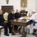 Pope Francis speaks with three U.S. cardinals -- Cardinals Robert W. McElroy of San Diego; Joseph W. Tobin of Newark, N.J.; and Blase J. Cupich of Chicago -- in the library of the Apostolic Palace at the Vatican Oct. 10, 2024. Cardinal Tobin said they met with the pope "to discuss challenges in the United States," but did not specify further. (CNS photo/Vatican Media)