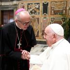 Los Angels Auxiliary Bishop Slawomir S. Szkredka shakes hands with Pope Francis at the Vatican.