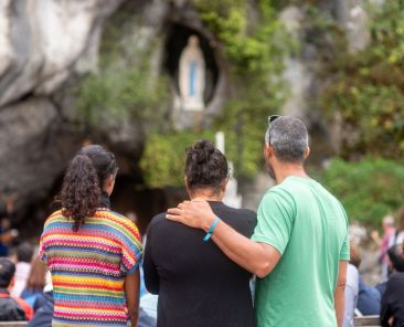 Pilgrims pray in front of the Grotto of the Apparitions in the Sanctuary of Our Lady of Lourdes, France, on Aug. 14, 2024. (OSV News photo/courtesy Lourdes Sanctuary)