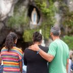 Pilgrims pray in front of the Grotto of the Apparitions in the Sanctuary of Our Lady of Lourdes, France, on Aug. 14, 2024. (OSV News photo/courtesy Lourdes Sanctuary)