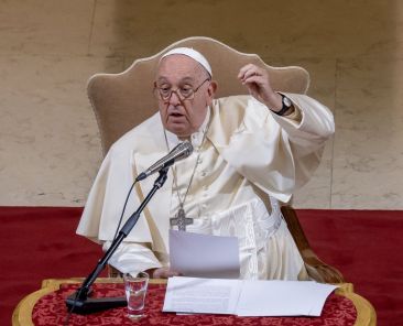 Pope Francis gestures as he speaks to staff and students of Rome's Pontifical Gregorian University, which now includes the Pontifical Biblical Institute and the Pontifical Oriental Institute Nov. 5, 2024. (CNS photo/Pablo Esparza)