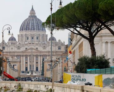 A cloth barricade reading "Rome Jubilee 2025" surrounds a construction site at the beginning of the broad boulevard leading to St. Peter's Square and St. Peter's Basilica Dec. 4, 2024. The city of Rome is preparing for the Holy Year with hundreds of roadworks and restoration projects. (CNS photo/Lola Gomez)