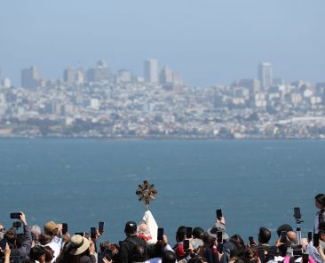 San Francisco Archbishop Salvatore J. Cordileone elevates the monstrance as he blesses the city and pilgrims after crossing the Golden Gate Bridge in San Francisco May 19, 2024. (OSV News photo/Bob Roller)