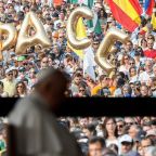 The word “PACE,” peace, is seen in the crowd gathered as Pope Francis recites the rosary with young people who are ill at the Chapel of Apparitions at the Shrine of Our Lady of Fátima in Fátima, Portugal, Aug. 5, 2023. (CNS photo/Lola Gomez)