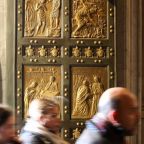 Visitors pass through the Holy Door of St. Peter’s Basilica on Christmas Day, Dec. 25, 2024, after it was opened by Pope Francis during Christmas Mass the night prior to mark the start of the Holy Year 2025. (CNS photo/Lola Gomez)