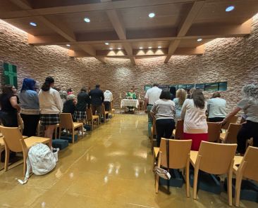 Father Mark Garrett, school chaplain, celebrates Mass for members of the Bishop Lynch High School community during a recent First Friday Rosary.