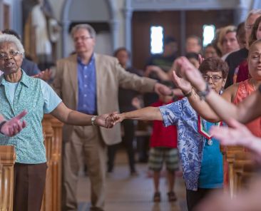 Worshippers join hands during the Our Father. Sunday Mass offers us several reminders on the importance of forgiveness, such as during the Our Father. (CNS photo/Jim West) See FAITH-ALIVE 13 Feb. 20, 2020.