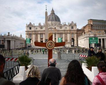 A pilgrim carries a wooden cross during jubilee celebrations in St. Peter’s Square at the Vatican Feb. 18, 2025, while Pope Francis continues treatment at Rome's Gemelli hospital. The 88-year-old pontiff was hospitalized Feb. 14 after more than a week of suffering from bronchitis and difficulty breathing. (OSV News photo/Guglielmo Mangiapane, Reuters)