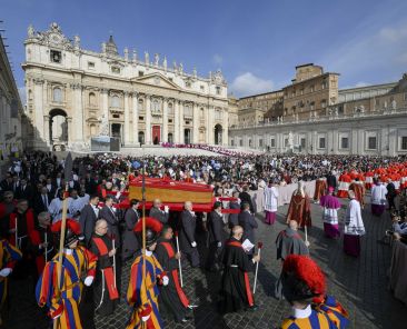Pallbearers carry the body of Pope Francis in his casket through St. Peter's Square on their way into St. Peter's Basilica at the Vatican April 23, 2025, as the pope's mortal remains are prepared for public viewing and prayer. (CNS photo/Vatican Media)