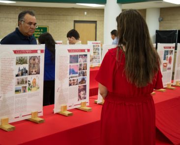 Juan Benitez (L) and Maribel Lopez (RT) visited The Saint Carlo Acutis Exhibition that is on display at Saint Mark the Evangelist Church cafeteria in Plano.