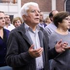 Worshippers recite the Lord's Prayer during Mass at Corpus Christi Church in Mineola, N.Y., Oct. 13. The Italian and English translations of the "Our Father" can give believers the wrong impression that God can and does lead people into temptation, Pope Francis said. (CNS photo/Gregory A. Shemitz, Long Island Catholic) See POPE-OUR-FATHER Dec. 11, 2017.