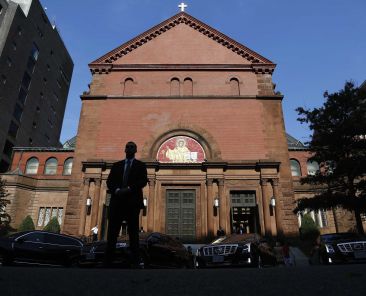 A file photo shows a security agent standing watch in the street as several U.S. Supreme Court justices prepare to depart the annual Red Mass at the Cathedral of St. Matthew the Apostle in Washington. A 41-year-old man was arrested Oct. 5, 2025, outside the cathedral ahead of this year's Red Mass on charges including possession of a Molotov cocktail and threats to kidnap or injure a person, according to police. (OSV News photo/ Jonathan Ernst, Reuters)
