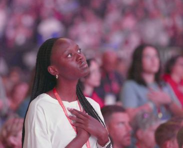 A young woman prays July 19, 2024, during the third revival night of the National Eucharistic Congress at Lucas Oil Stadium in Indianapolis. In a statement Oct. 15, 2025, Bishop Earl A. Boyea of Lansing, Mich., encouraged prayer and a renewed commitment to journey with young people in their vocations during National Vocation Awareness Week Nov. 2-8. Bishop Boyea is chair of the U.S. bishops' Committee on Clergy, Consecrated Life and Vocations. (OSV News photo/Bob Roller)