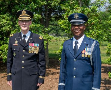 Father David Kirk, an Army chaplain who holds the rank of major, and Father Nelson Ogwuegbu, an Air Force chaplain who holds the rank of captain, pose for a photo May 26, 2021, at Arlington National Cemetery in Virginia. (OSV News photo/Matt Riedl, Arlington Catholic Herald)