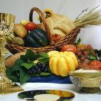 The foods of the secular Thanksgiving feast are pictured with the spiritual food of the Eucharist -- the word in Greek means gratitude or thankfulness. At Mass on Thanksgiving Day -- Nov. 27 this year -- many liturgies give special regard to spiritual and earthly sustenance. Christ gave new meaning to the bread and wine at the Last Supper with his words, "This is my body" and "This is my blood," enacting his self-gift of suffering on the cross for all people. (CNS photo illustration courtesy Southern Nebraska Register) (Nov. 19, 2003)