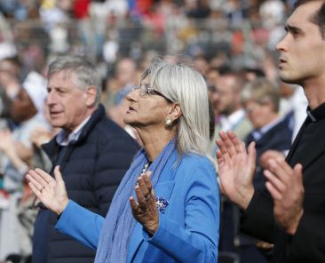 People pray the Lord's Prayer as they attend Pope Francis' celebration of the closing Mass of Italy's National Eucharistic Congress at the municipal stadium in Matera, Italy, Sept. 25, 2022. (CNS photo/Paul Haring)