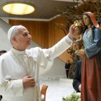Pope Leo XIV places a crown on a statue of Mary and the Child Jesus during a meeting with participants in the Jubilee of the Roma, Sinti and Traveling Peoples in the Paul VI Audience Hall at the Vatican Oct. 18, 2025. (CNS photo/Vatican Media)