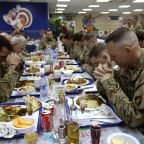 A file photo shows U.S. troops praying before eating a Thanksgiving meal at a NATO base in Kabul, Afghanistan. (OSV News photo/Omar Sobhani, Reuters)
