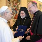 Pope Leo XIV greets Greek Orthodox Archbishop Nikitas of Thyateira and Great Britain, president of Conference of European Churches, and Catholic Archbishop Gintaras Grušas of Vilnius, president of the Council of European Bishops' Conferences, during a meeting in the Apostolic Palace at the Vatican Nov. 6, 2025. (CNS photo/Vatican Media)