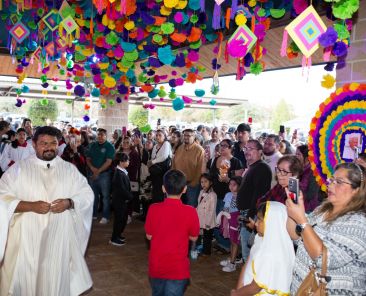 The All Souls and All Saints celebration at San Juan Diego Catholic Church in Dallas was celebrated on Saturday evening. Rev Daniel Rendon blesses the ofrenda.