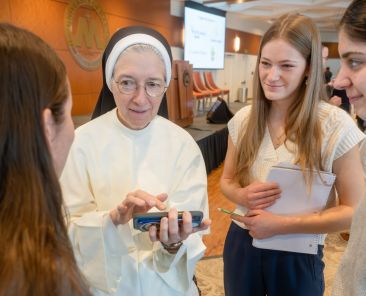 Sister Mary Diana Drager, a physician who serves the sisters in her community, the Dominican Sisters of St. Cecilia Congregation in Nashville, Tenn., chats with students during a break Dec. 5, 2025, at the St. Gianna Medical Professionals Conference at the University of Mary in Bismarck, N.D. (OSV News photo/Mike McCleary, courtesy University of Mary)