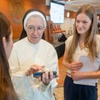 Sister Mary Diana Drager, a physician who serves the sisters in her community, the Dominican Sisters of St. Cecilia Congregation in Nashville, Tenn., chats with students during a break Dec. 5, 2025, at the St. Gianna Medical Professionals Conference at the University of Mary in Bismarck, N.D. (OSV News photo/Mike McCleary, courtesy University of Mary)