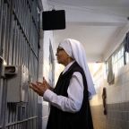 Sister Nelida Molina, of the Eudist Servants of the 11th Hour, talks with inmates during a visit to the La Mesa State Penitentiary on Dec. 1, 2025, in Tijuana, Mexico. Later that morning Mass was celebrated on the birthday of Mother Antonia Brenner, founder of the order, which does ministry and social work in the prison, as well as work with cancer and HIV/AIDS patients and the poor. Twelve years after her death at age 86, members of her religious community are launching an effort to canonize Mother Antonia. (OSV News photo/David Maung)