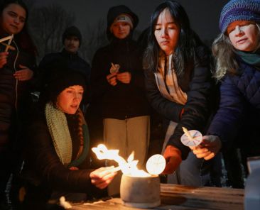 People attend a candlelight vigil at Lippitt Memorial Park in Providence, R.I., Dec. 14, 2025, following a mass shooting at Brown University. The shooting left two students dead and nine others injured at the Ivy League school, where classes and exams have been canceled. (OSV News photo/Kylie Cooper, Reuters)