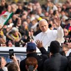 Pope Leo XIV greets visitors and pilgrims from the popemobile as he rides around St. Peter's Square at the Vatican before his weekly general audience Dec. 17, 2025. (CNS photo/Lola Gomez)