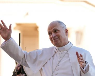 Pope Leo XIV greets visitors and pilgrims from the popemobile as he rides around St. Peter's Square at the Vatican before his weekly general audience Dec. 31, 2025. (CNS photo/Lola Gomez)