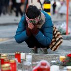 A person prays at a makeshift memorial for the victims outside Le Constellation bar in the upscale ski resort of Crans-Montana in southwestern Switzerland Jan. 2, 2026, after a fire and explosion during a New Year's Eve party. Around 40 people were killed and 115 others injured, most of them seriously, after a fire ripped through the bar at the Swiss Alpine resort less than two hours after midnight, police said. (OSV News photo/Stephanie Lecocq, Reuters)