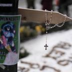 A rosary hangs from a cross at a makeshift memorial in Minneapolis Jan. 25, 2026, at the site where a man was fatally shot by federal agents trying to detain him. The Department of Homeland Security said Alex Pretti, a 37-year-old intensive care nurse, had a handgun and approached Border Patrol officers during a targeted operation Jan. 24. (OSV News photo/Tim Evans, Reuters)
