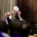 Archbishop Rino Fisichella, pro-prefect of the Dicastery for Evangelization's section for new evangelization and the chief organizer of the Holy Year 2025, elevates the Eucharist during Mass in the Basilica of Sant'Andrea della Valle March 30, 2025, in Rome. (CNS photo/Pablo Esparza)