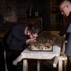 A monk from the local Franciscan community venerates the relics of St. Francis, which were exhumed from their shrine in the Basilica of St. Francis in Assisi, Italy, the morning of Feb. 21, 2026. The remains were exhumed in the presence of the friars and placed on a specially prepared table in the crypt, before being displayed for public veneration, which began Feb. 22 and runs through March 22. (OSV News photo/courtesy Sala Stampa Sacro Convento Assisi)