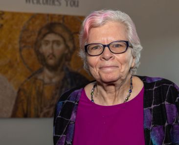 Mary Ellen Pereyra, a retired hospice nurse and longtime caregiver, poses for a photo at St. Mark the Evangelist Catholic Church in Plano on Feb. 11 before the Diocese of Dallas’ Mass for Caregivers, held on the World Day of the Sick to support and recognize those who care for ill and homebound loved ones.