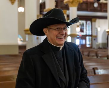 Msgr. Ruiz with Cowboy Hat (4 of 4)