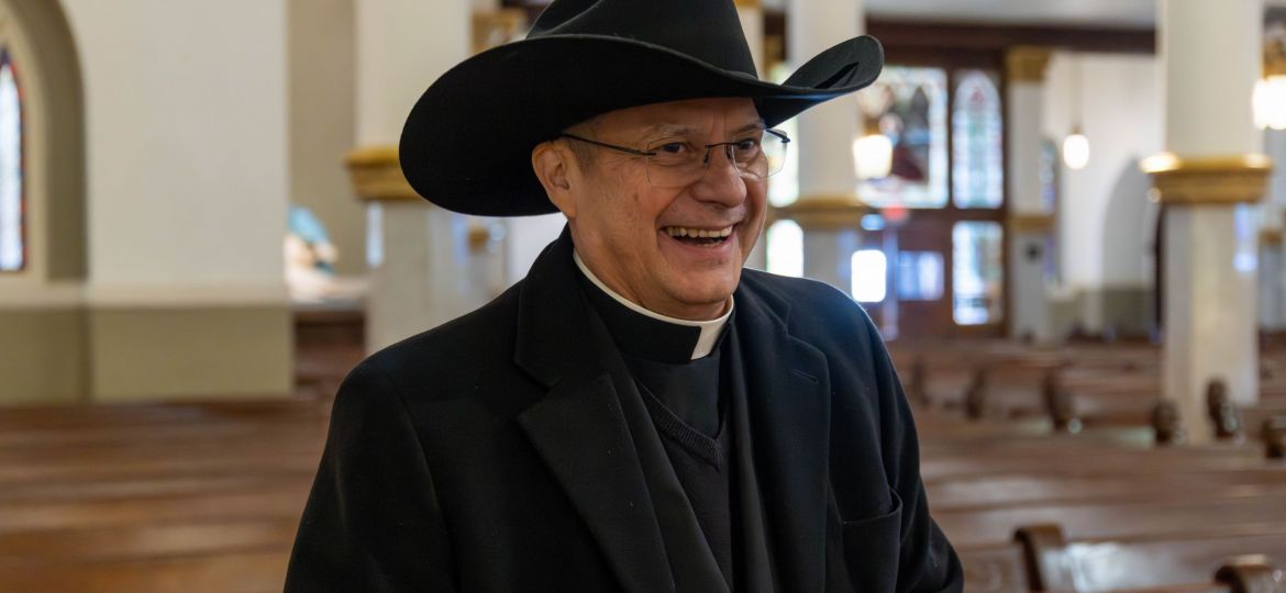 Msgr. Ruiz with Cowboy Hat (4 of 4)