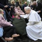 Pope Leo XIV greets a child in the Lourdes Grotto at the Vatican Gardens on the World Day of the Sick Feb. 11, 2026. (OSV News photo/Simone Risoluti, Vatican Media)